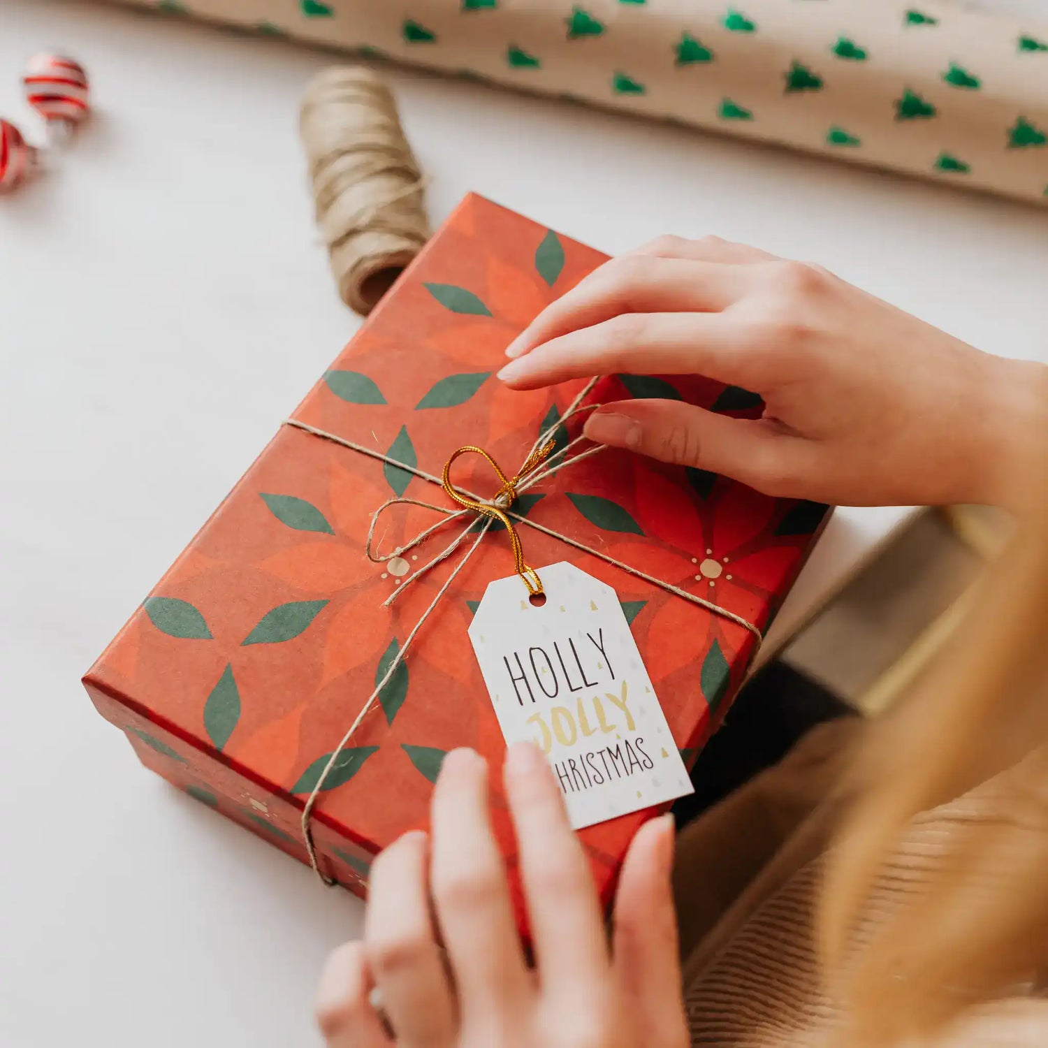 Person Opening a Christmas Gift